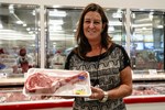 Rosemary Anderson Vinton Holding a Tomahawk Steak